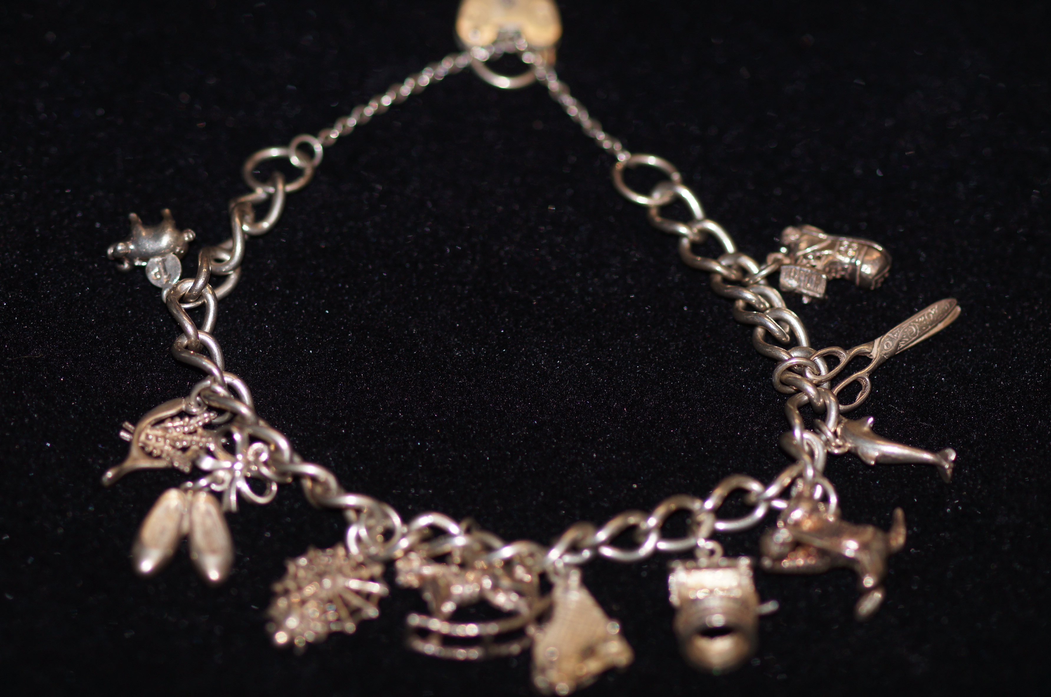 Silver Charm Bracelet with 11 x Charms 35.7 grams