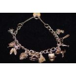 Silver Charm Bracelet with 11 x Charms 35.7 grams