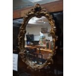 Gilt framed plaster mirror