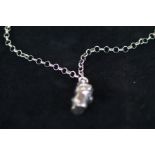 Silver necklace with teddy bear pendant