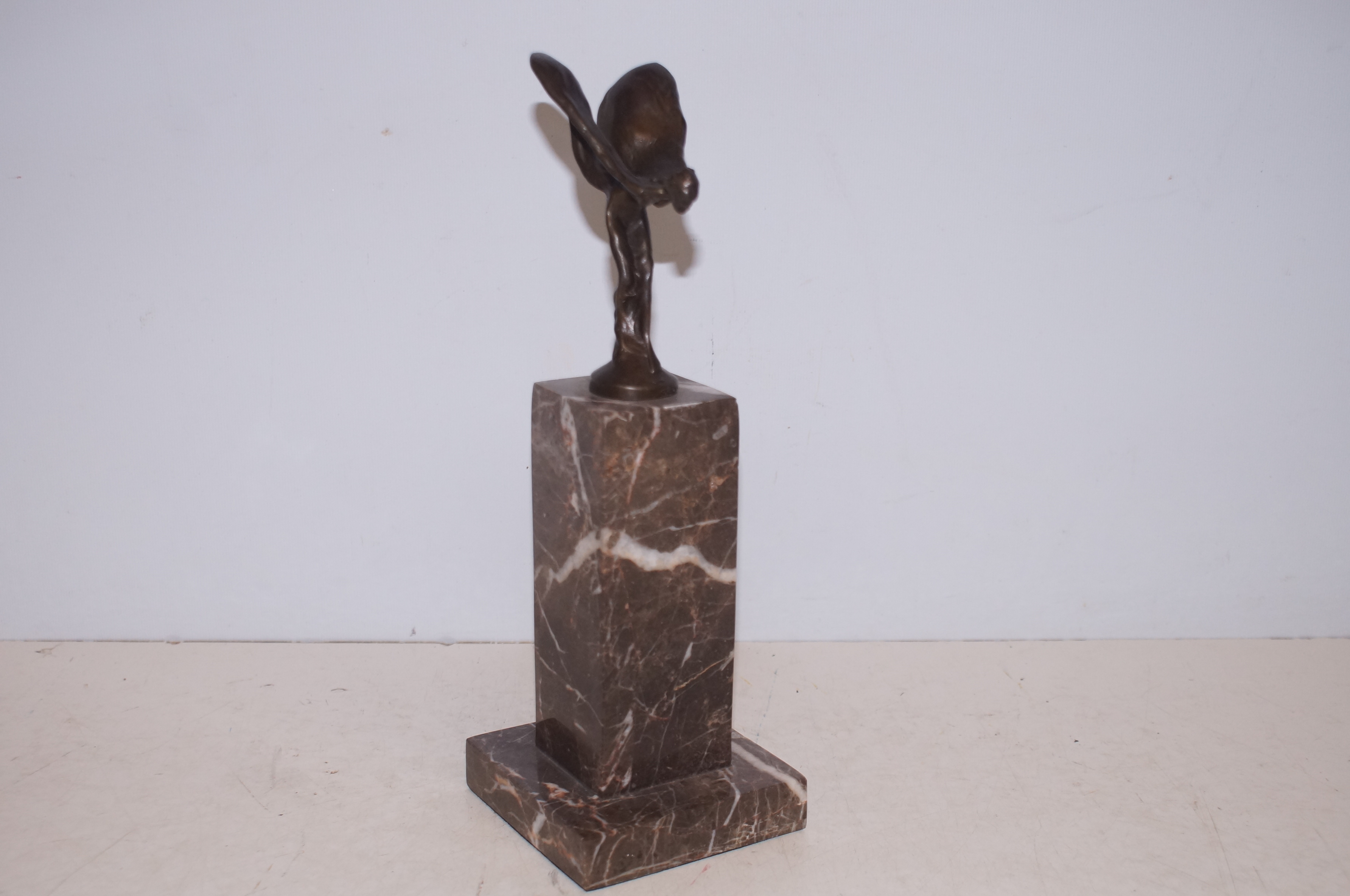 Spirit of ecstasy on marble base Height 27 cm