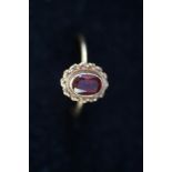 9ct Gold ring set with red stone Size L