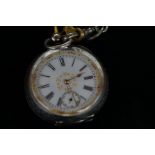 Silver pocket watch with key