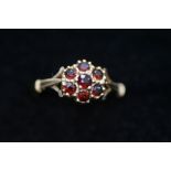 9ct Gold dress ring set with 7 garnets Size N