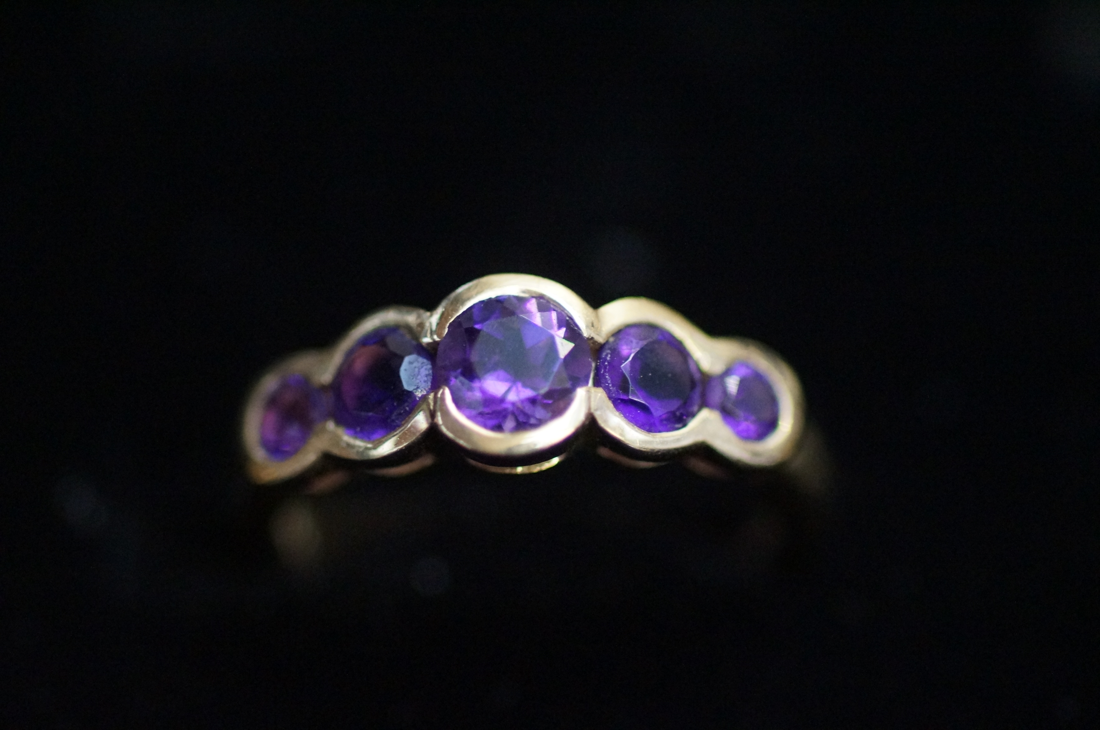 9ct Gold dress ring, set with 5 amethyst Size L