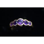 9ct Gold dress ring, set with 5 amethyst Size L