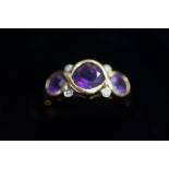 9ct Gold dress ring, set with 3 amethyst & 4 chip