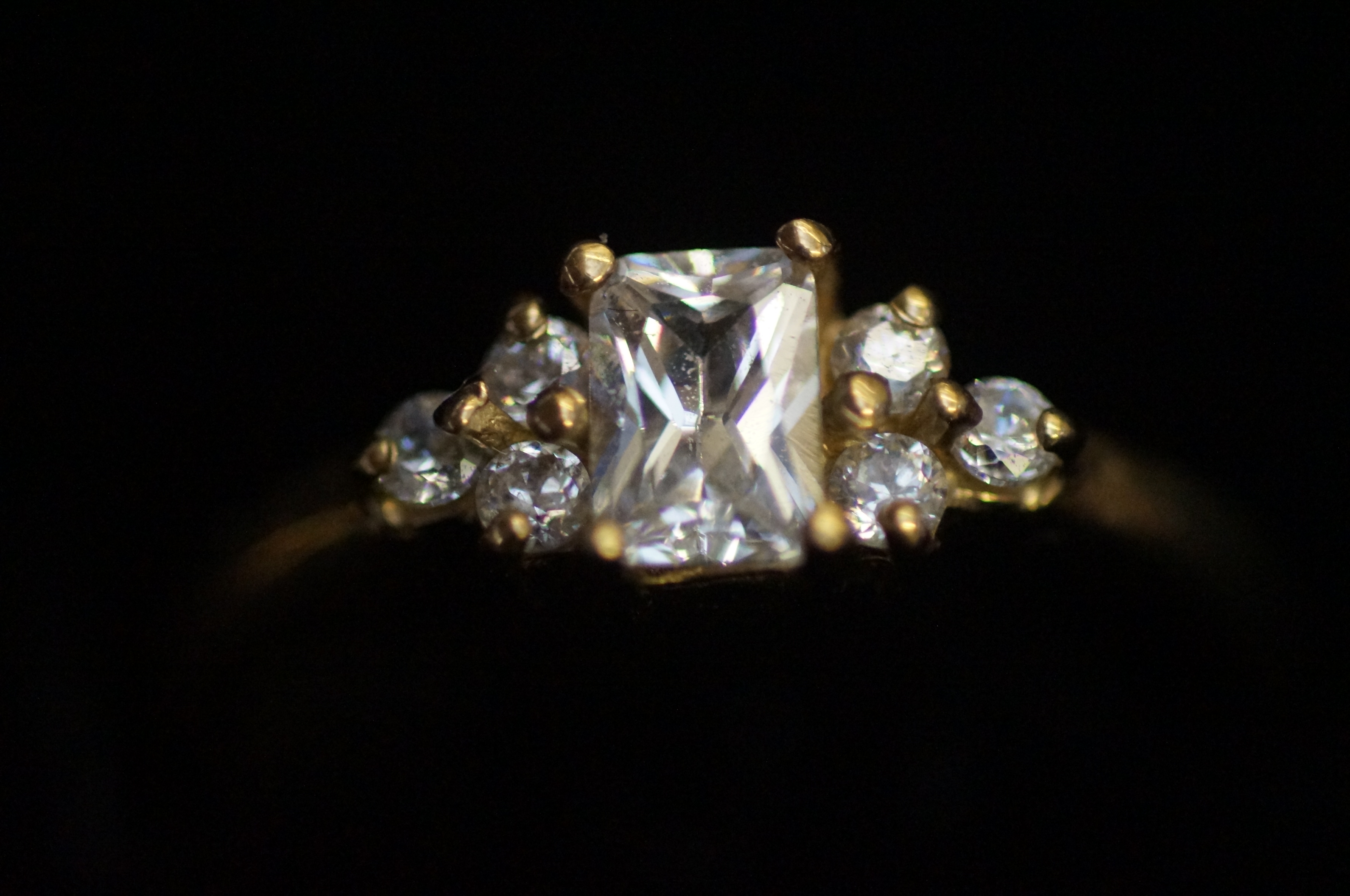 9ct Gold dress ring, set with 7 white stones Size