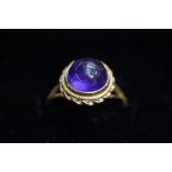 9ct Gold dress ring, set with round purple stone