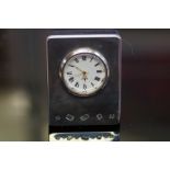 Silver faced small mantle clock Height 7 cm