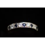 9ct Gold ring set with 4 white stones & 5 blue sto