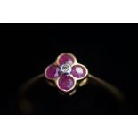 9ct Gold ring set with 4 garnets & central diamond