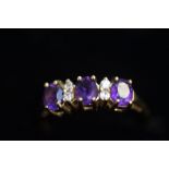 9ct Gold ring set with amethyst & white stones Siz