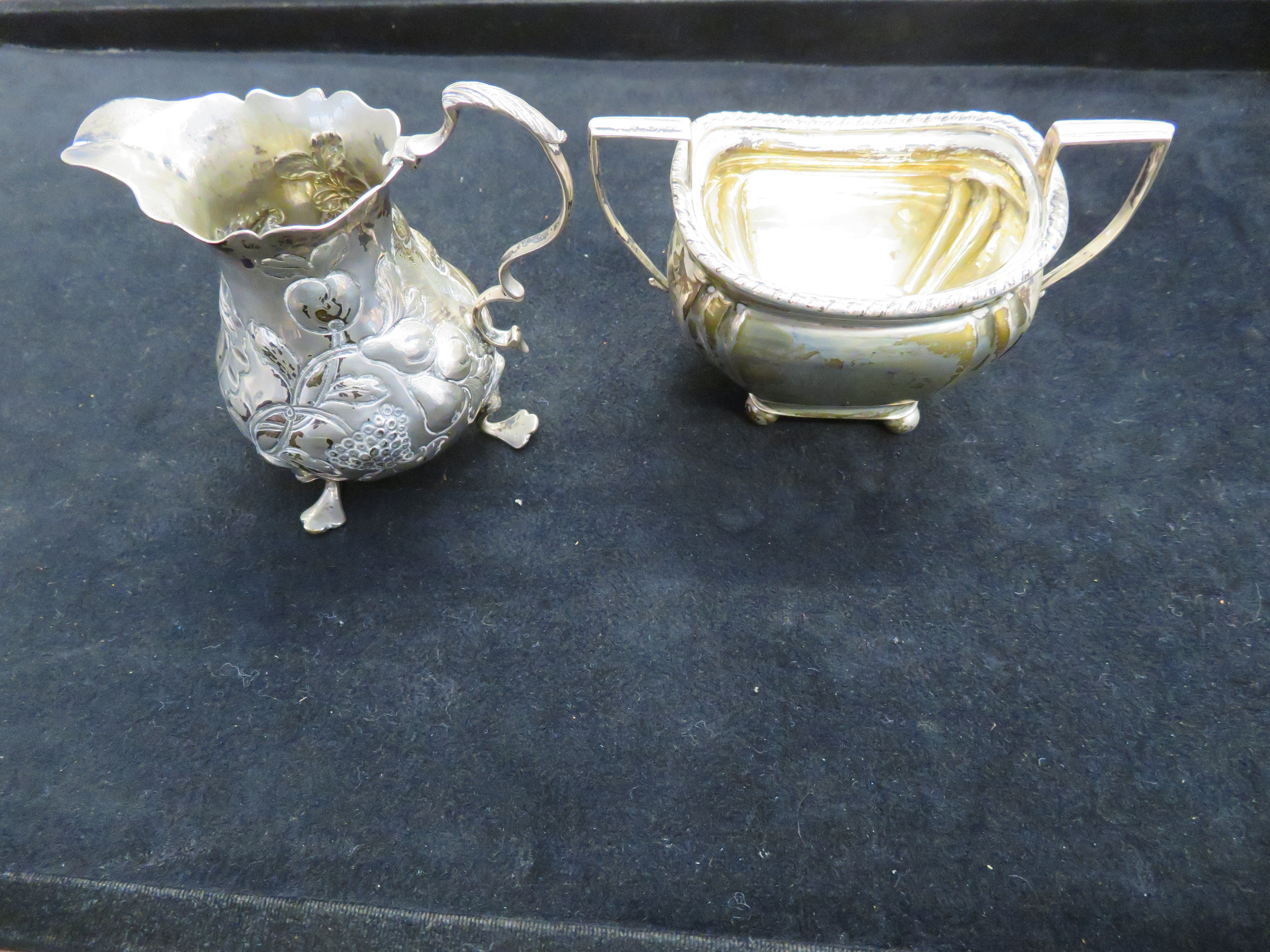 Silver cream jug with crowned leopards head togeth