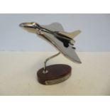 Chrome vulcan bomber on wooden base Height 18 cm