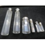 Collection of scent bottles with silver tops