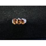 9ct Gold ring set with 3 orange stones & diamonds