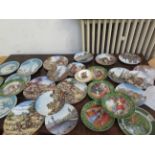 A large collection of cabinet plates