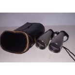 A pair of cased binoculars