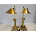 A pair of brass lamps