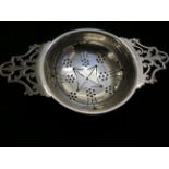 Silver tea strainer with Sheffield hallmark, lengt