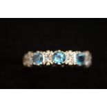 9ct gold set with diamonds and blue gem stones. Si