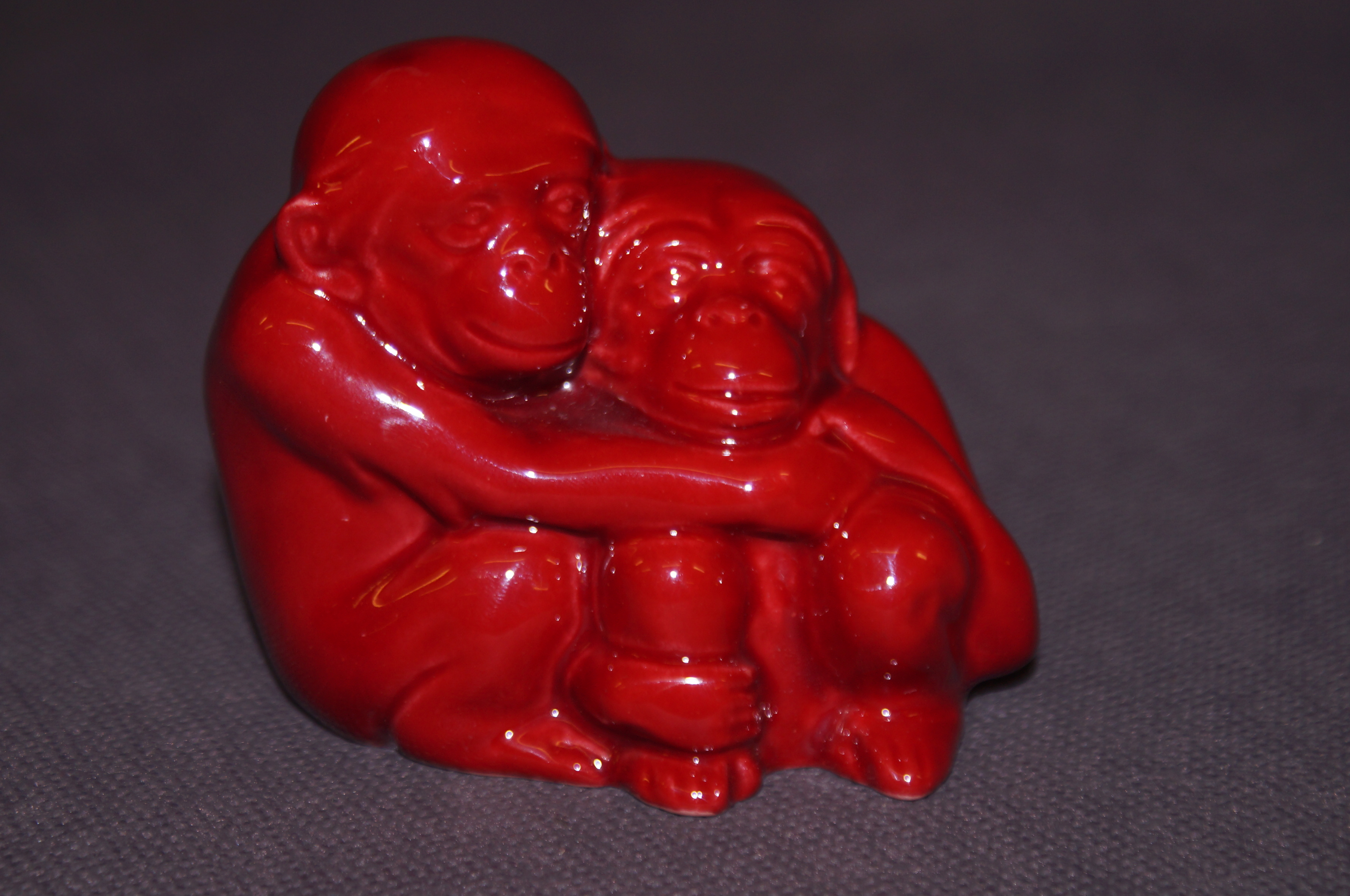 Royal Doulton Flambé paperweight, hugging monkeys.