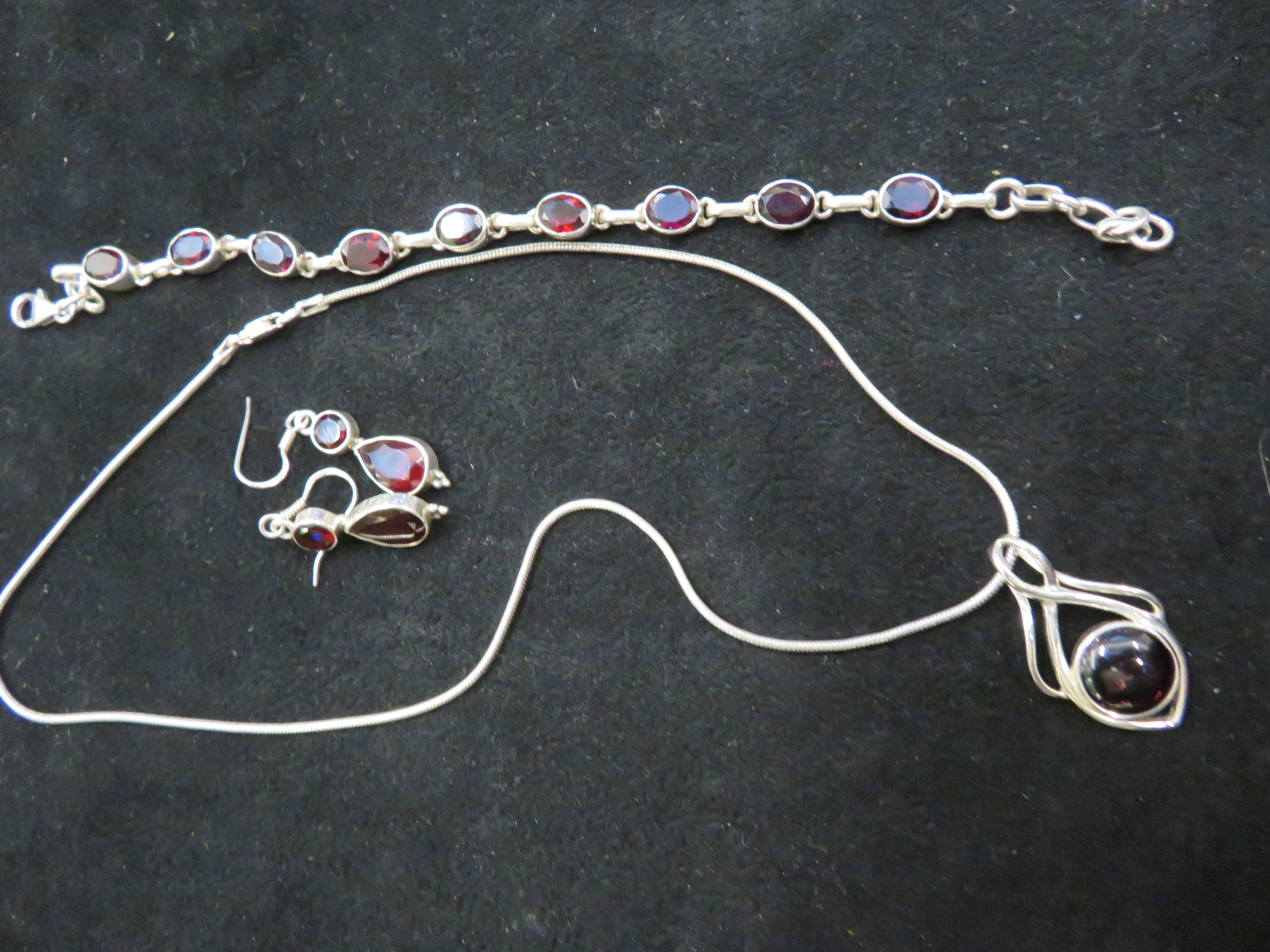 Silver necklace, bracelet and earrings