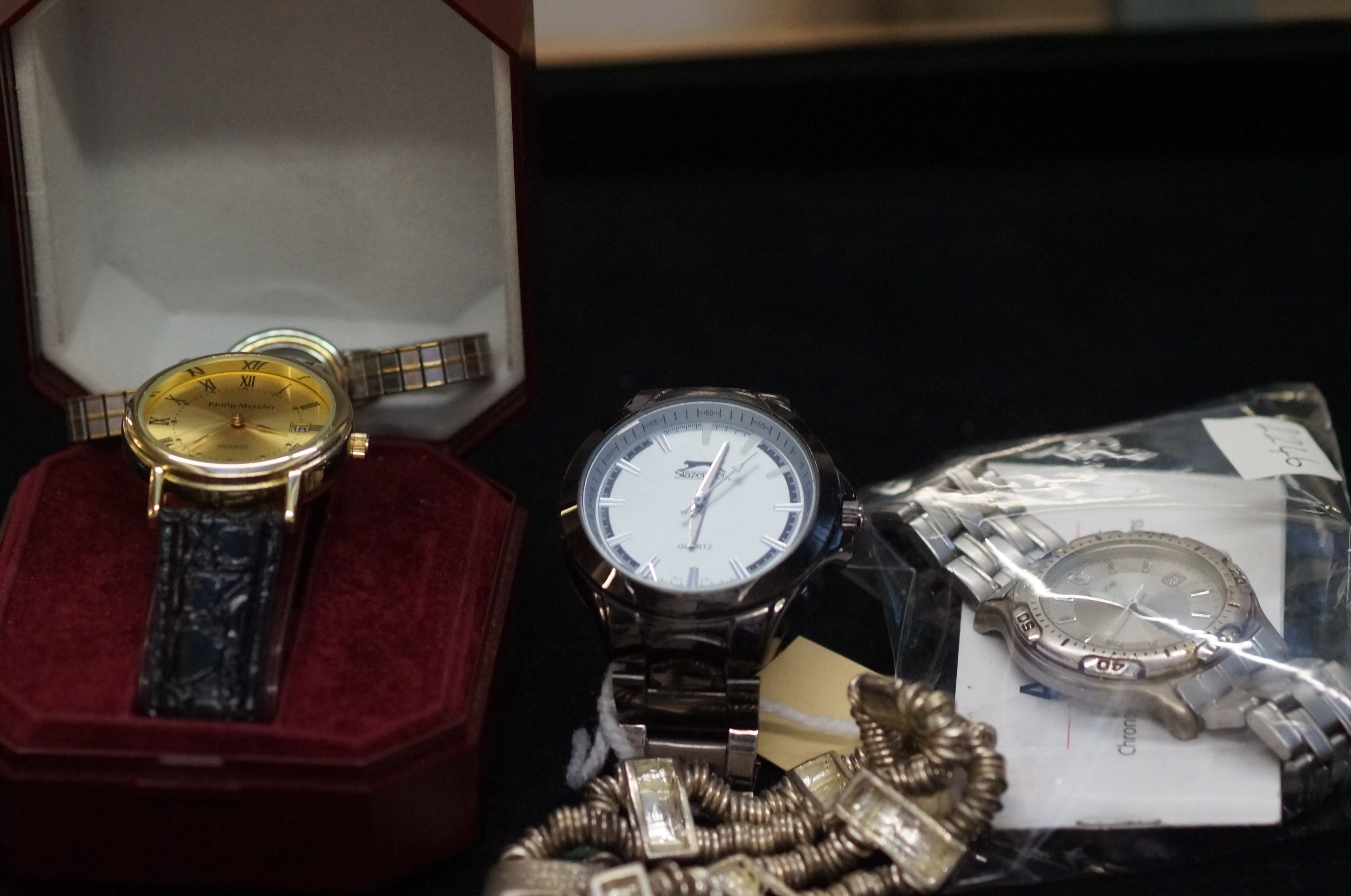 A collection of fashion watches to include a white