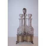 3 cut glass decanters in a silver plated holder- 4