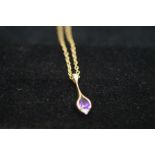 A 9ct gold chain and pendent set with amethyst sto
