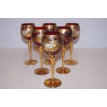 A set of 6 ornate wine glasses painted gilt decora