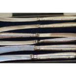 Set of 6 silver cased Silver Knives together with