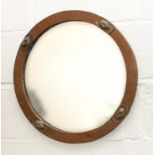 A round copper Glasgow School of Art wall mirror