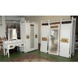 An arts and crafts 3 piece bedroom suite comprising 3 door wardrobe 1 smaller wardrobe and a