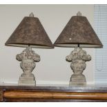 A pair of stone effect lamps with shades.