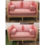 A pair of two seater sofas covered in silk striped fabric, dimensions 136cm wide x 84cm deep