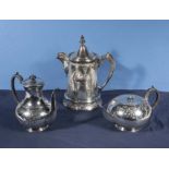 A silver plated water jug and a two piece tea set