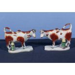 A matched pair of early 19th century Yorkshire pottery cow creamers, 6" high