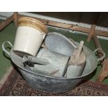 A tin bath and contents.