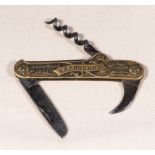 A Russian pre-revolution brass waiters champagne cork screw and knife, with Kaufman and Son, soligen