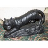 A large and very heavy 20th century tiger on stand