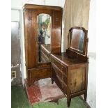 An oak wardrobe and dressing table.