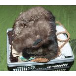 A box of vintage linen, handbags and two fur muffs