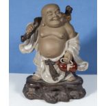 A Chinese pottery figure of Hotei