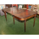 A Georgian mahogany dining table