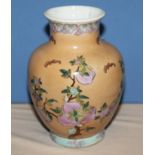 A Chinese peach ground vase decorated with flowers