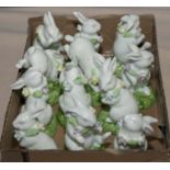 A box containing small porcelain rabbits