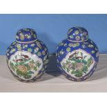 A pair of Chinese Famille Rose lidded ginger jars decorated with floral decorations, seal marks to