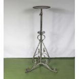 A metal plant or lamp stand adjustable.